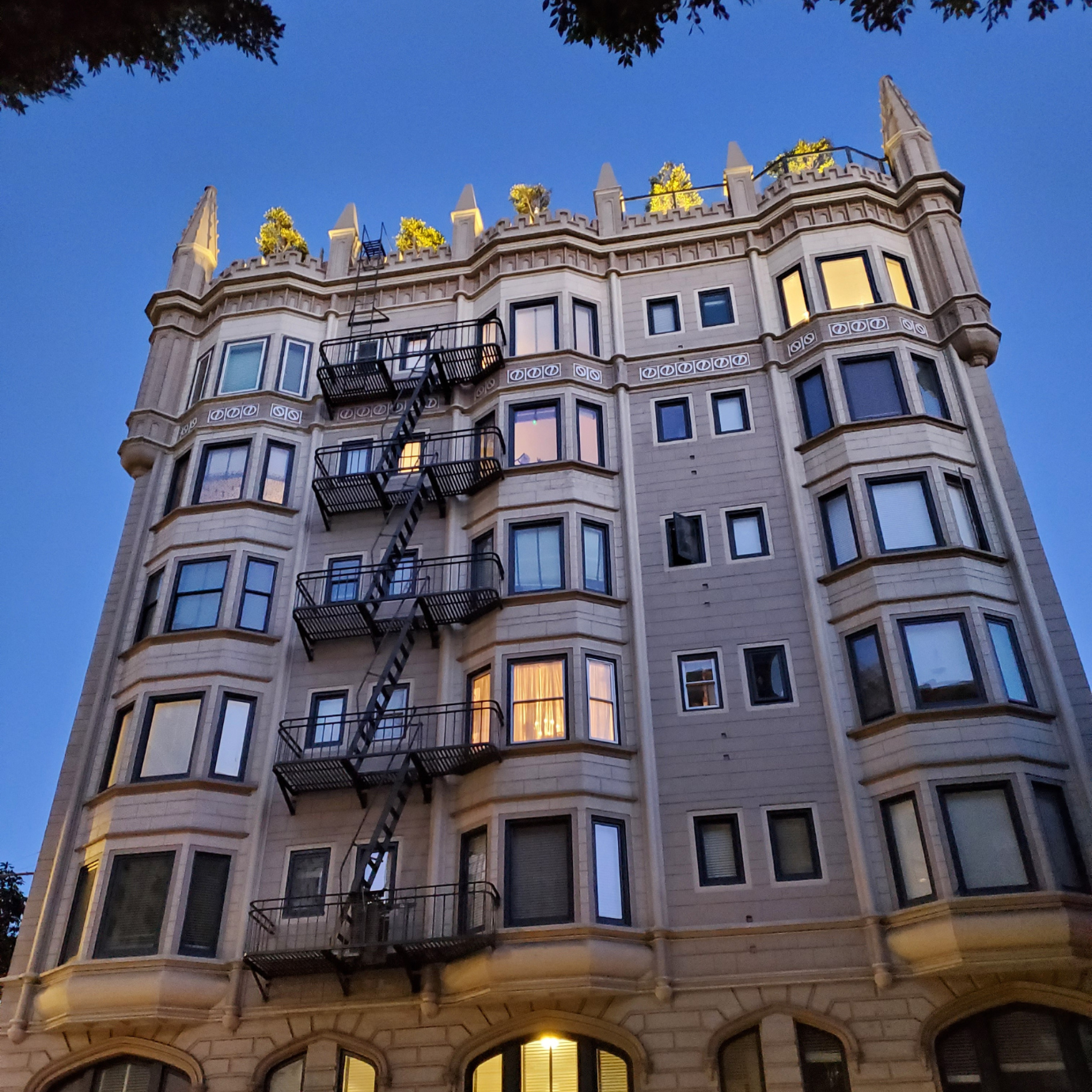 An apartment building at dusk in a residential San Francisco neighborhood